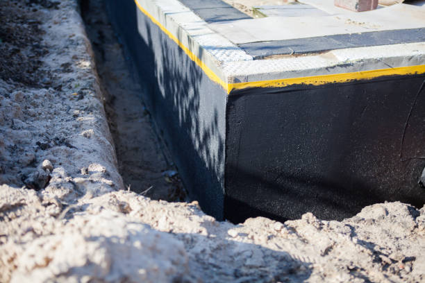 Professional Waterproofing technician working in Haysville, KS